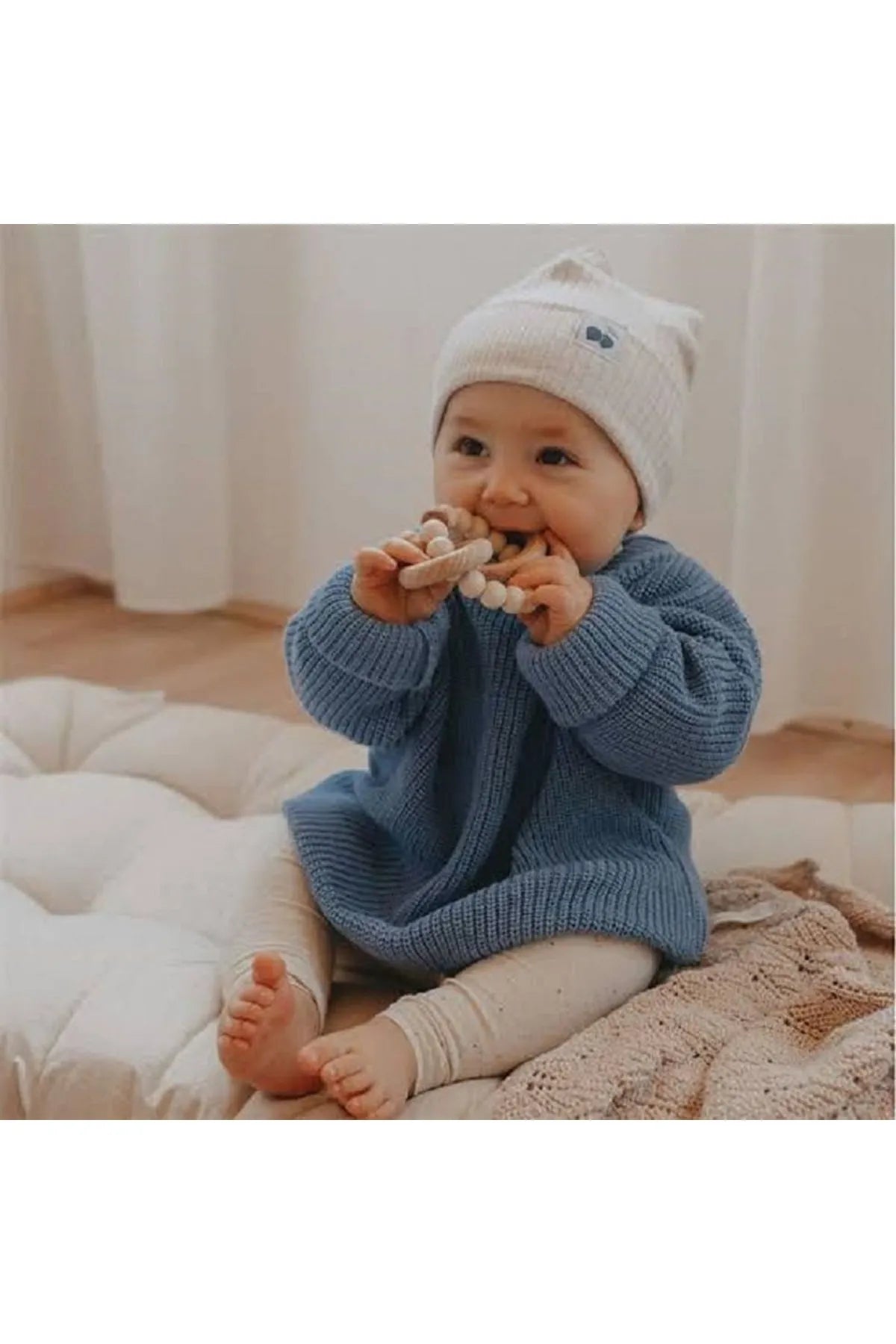 Deep indigo baby sweater. Rich and sophisticated, perfect for a stylish look. Made from soft, organic cotton