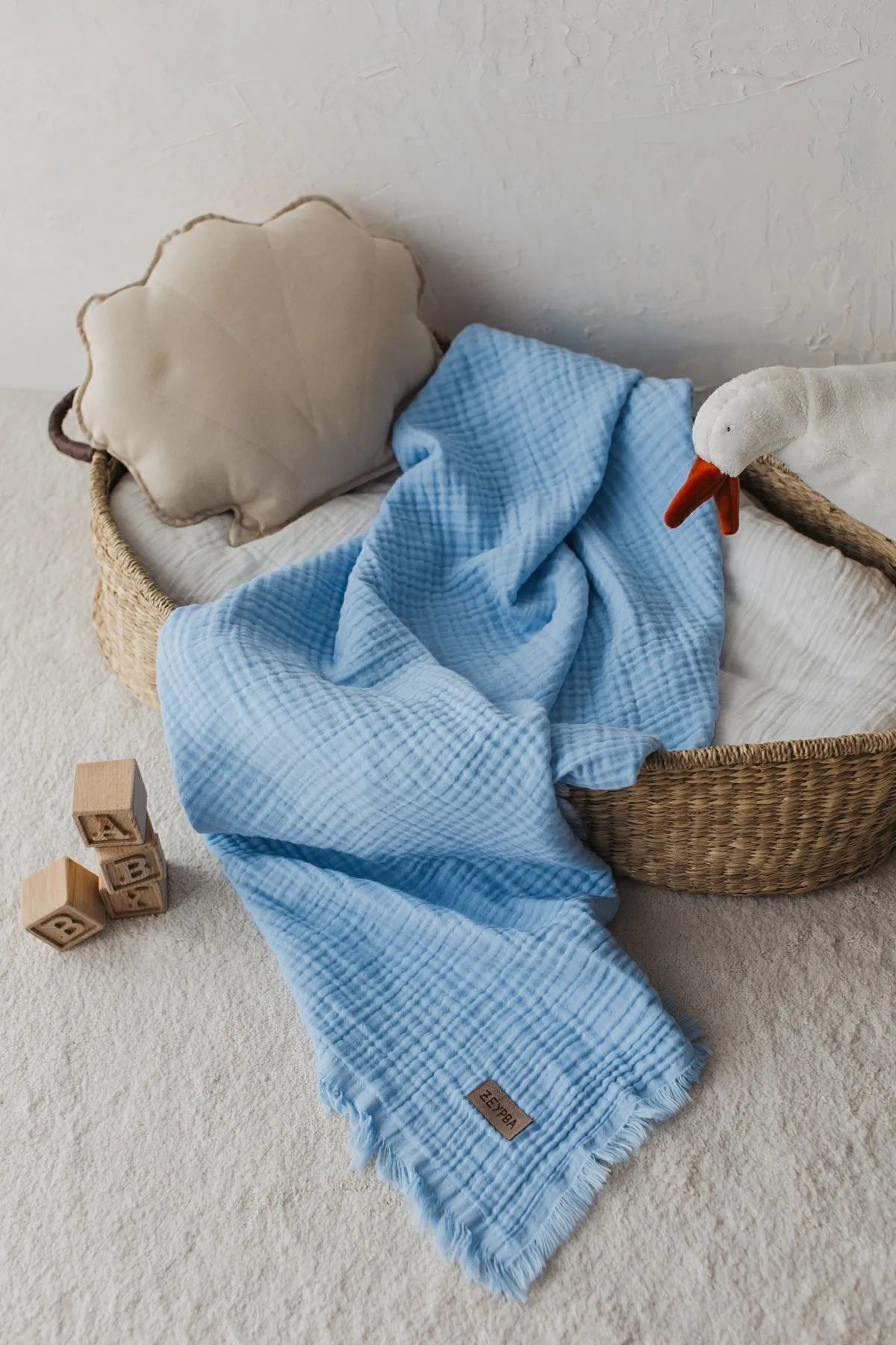 Light and airy sky blue muslin blanket, perfect for summer days