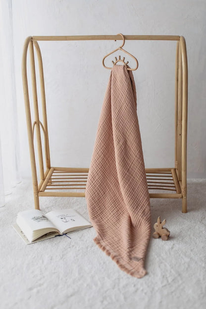 Gentle and soothing salmon pink muslin blanket for babies and toddlers