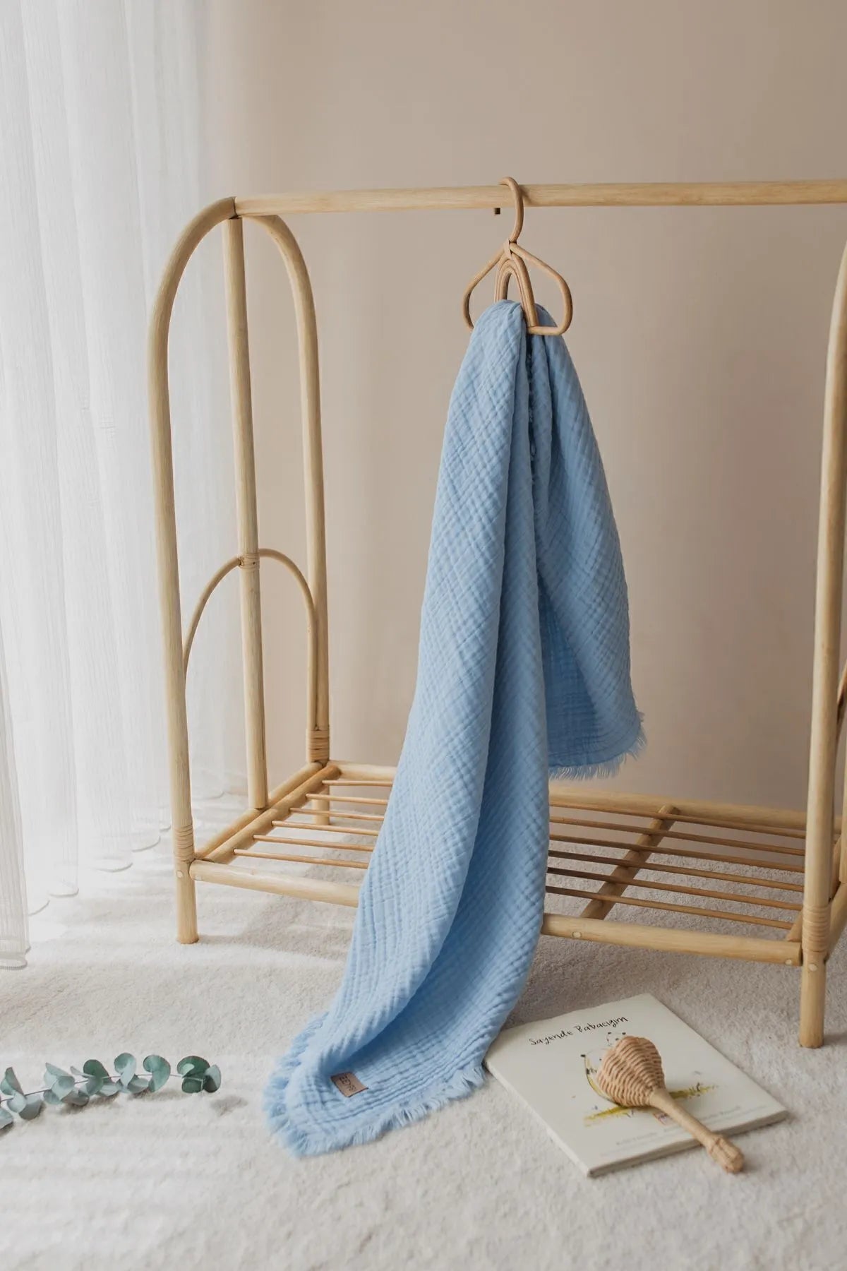 Light and airy sky blue muslin blanket, ideal for summer adventures