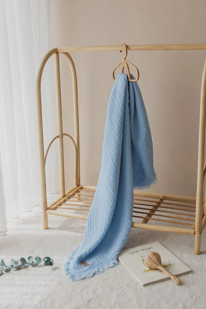 Light and airy sky blue muslin blanket, ideal for summer adventures