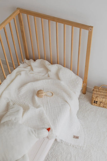 Creamy ecru muslin blanket, a timeless and elegant option