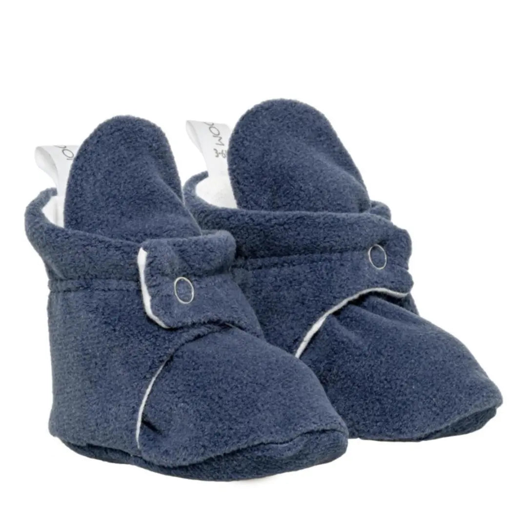 Classic navy blue baby booties, a timeless choice for boys and girls