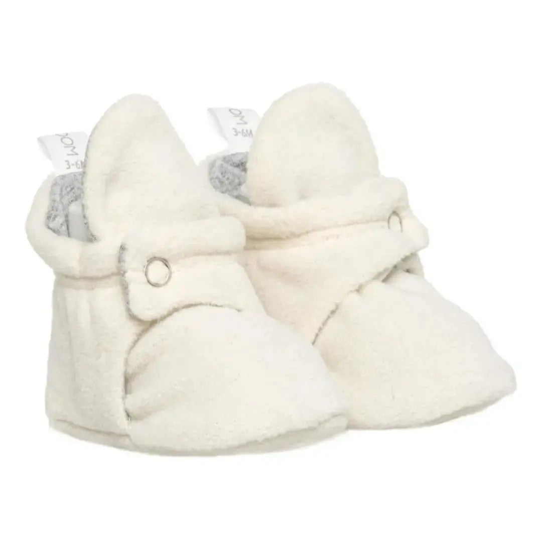 Classic white baby booties with easy-to-use snaps