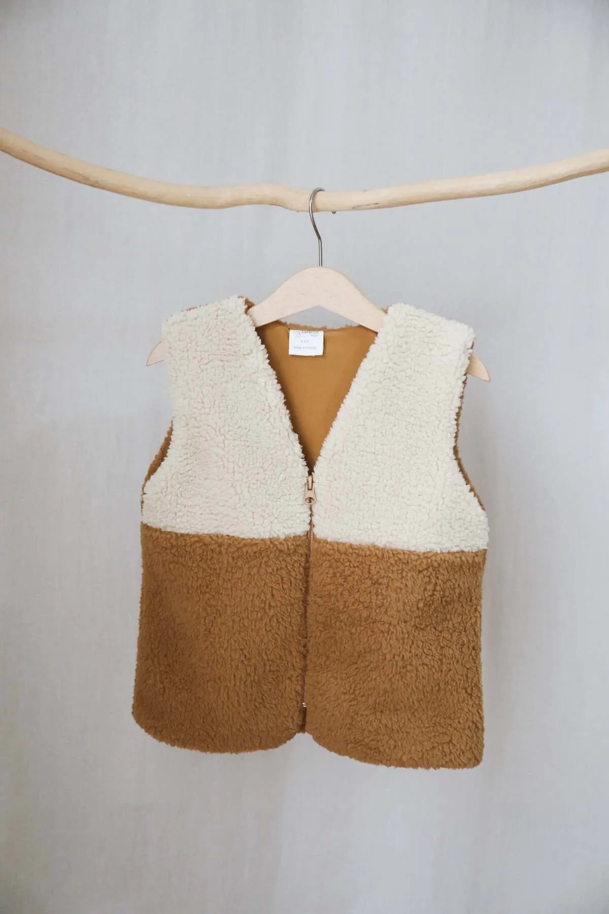 Soft and cuddly brown teddy vest with a cute hood