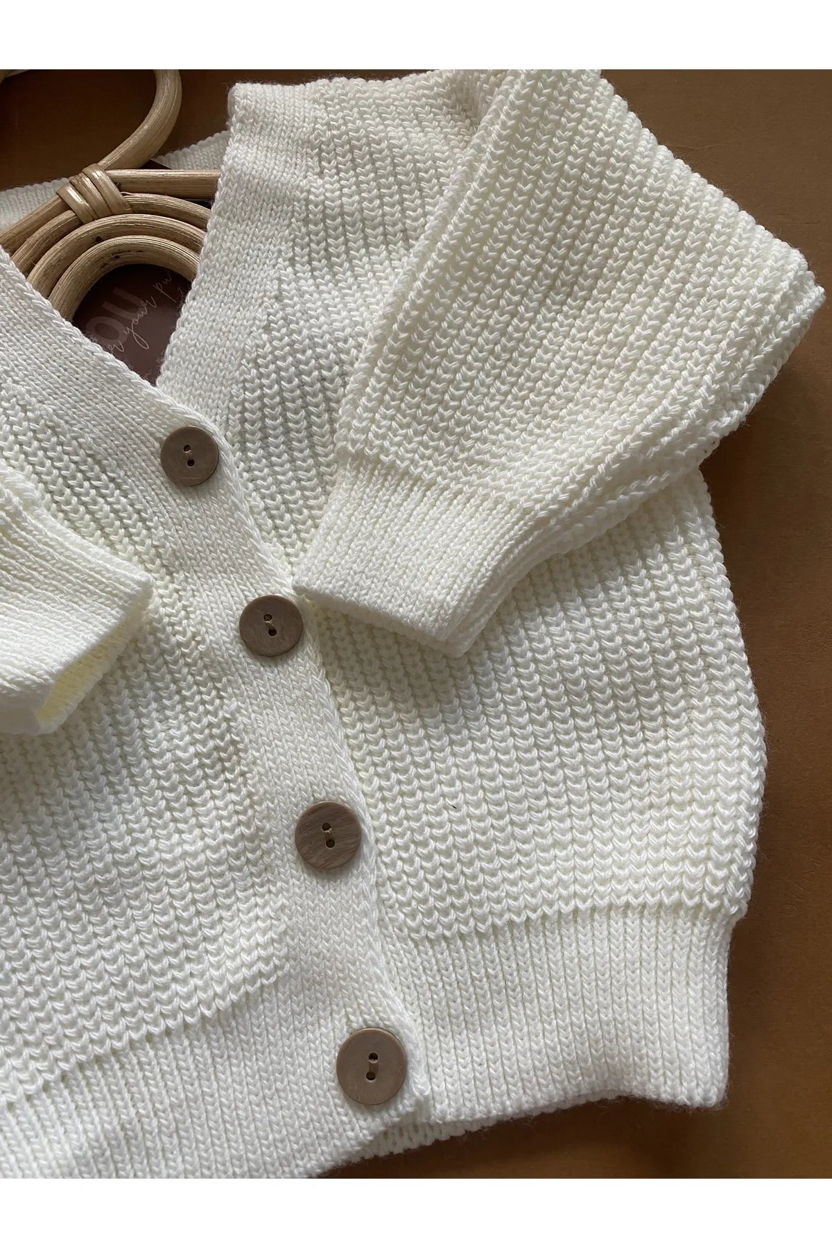 Cozy and warm white cardigan with a cute button closure