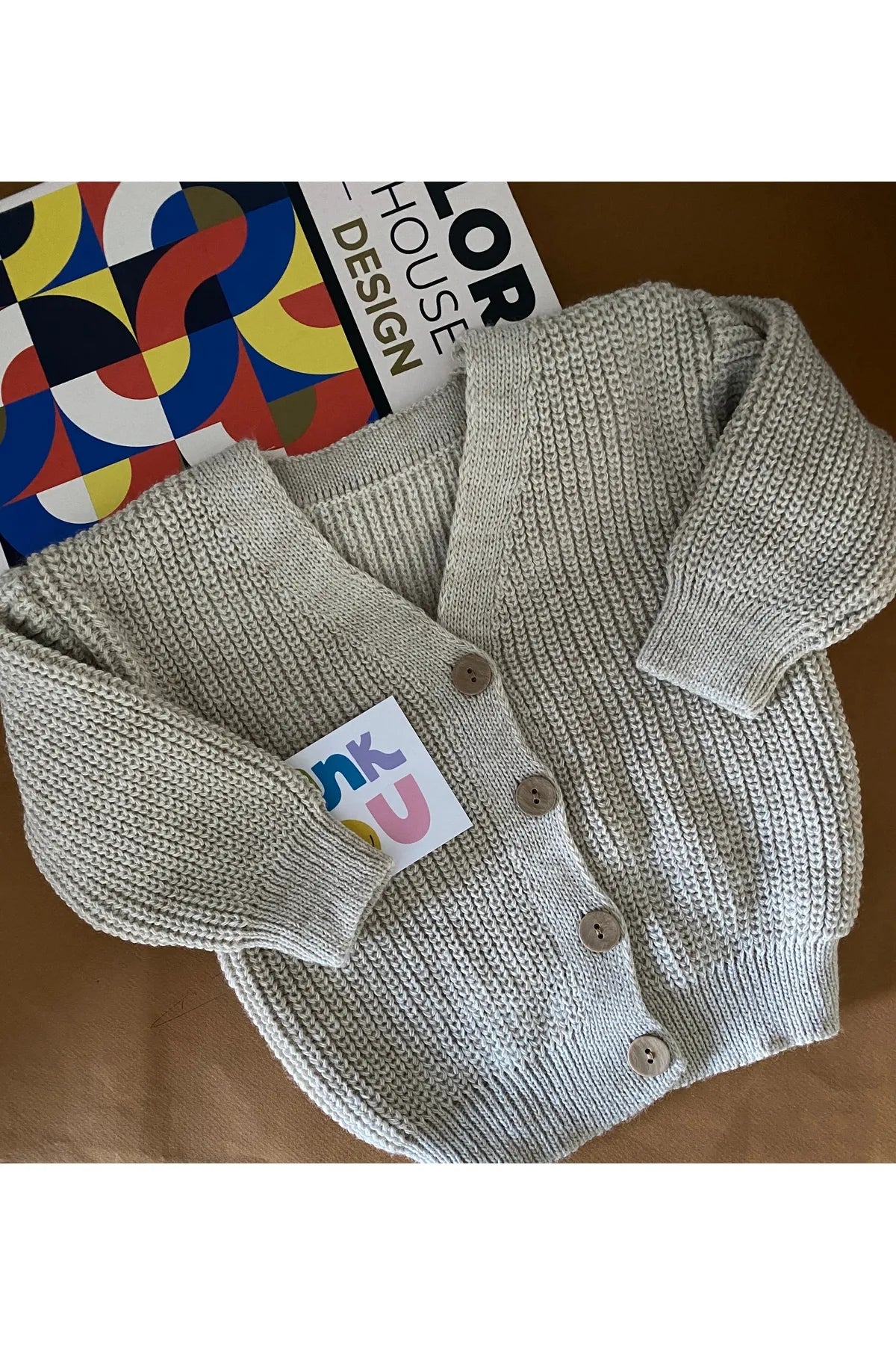 Stylish grey cardigan for babies, perfect for layering