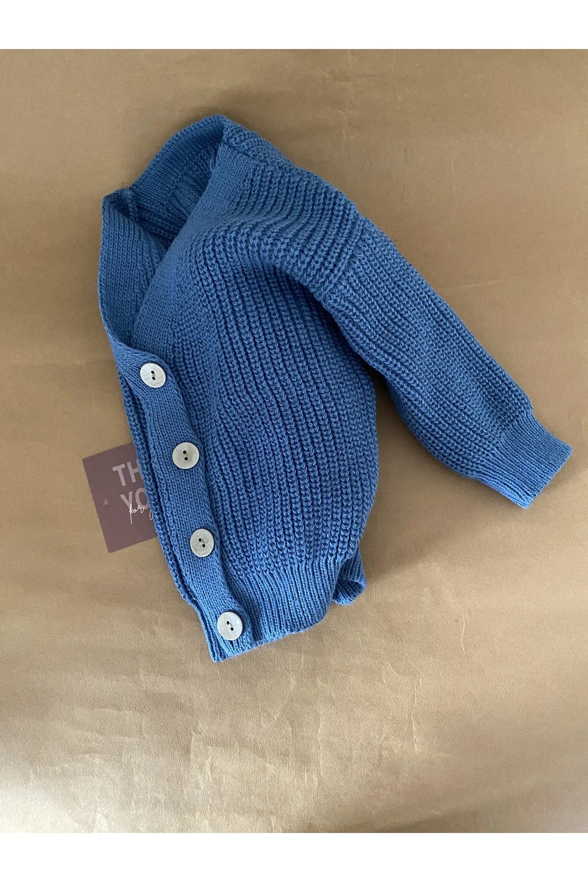 Calming indigo blue knit cardigan for babies, ideal for a cozy look