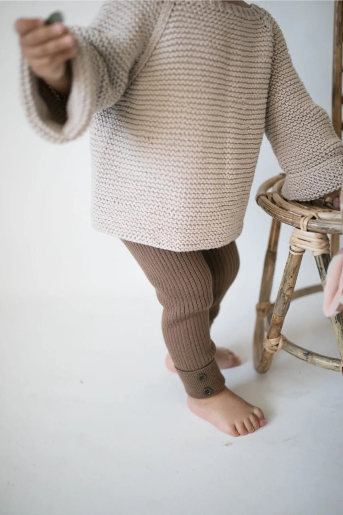 Cozy brown knit leggings with a high waist, perfect for keeping babies warm