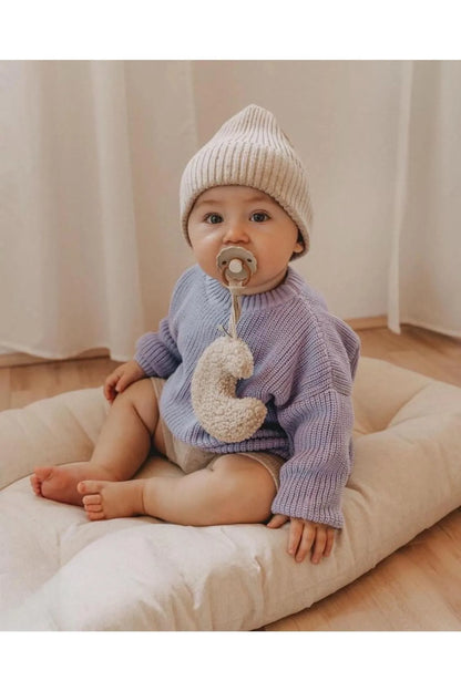 Lavender-hued baby sweater. Soft and feminine, made from breathable organic cotton. Keeps your little one cozy and comfortable