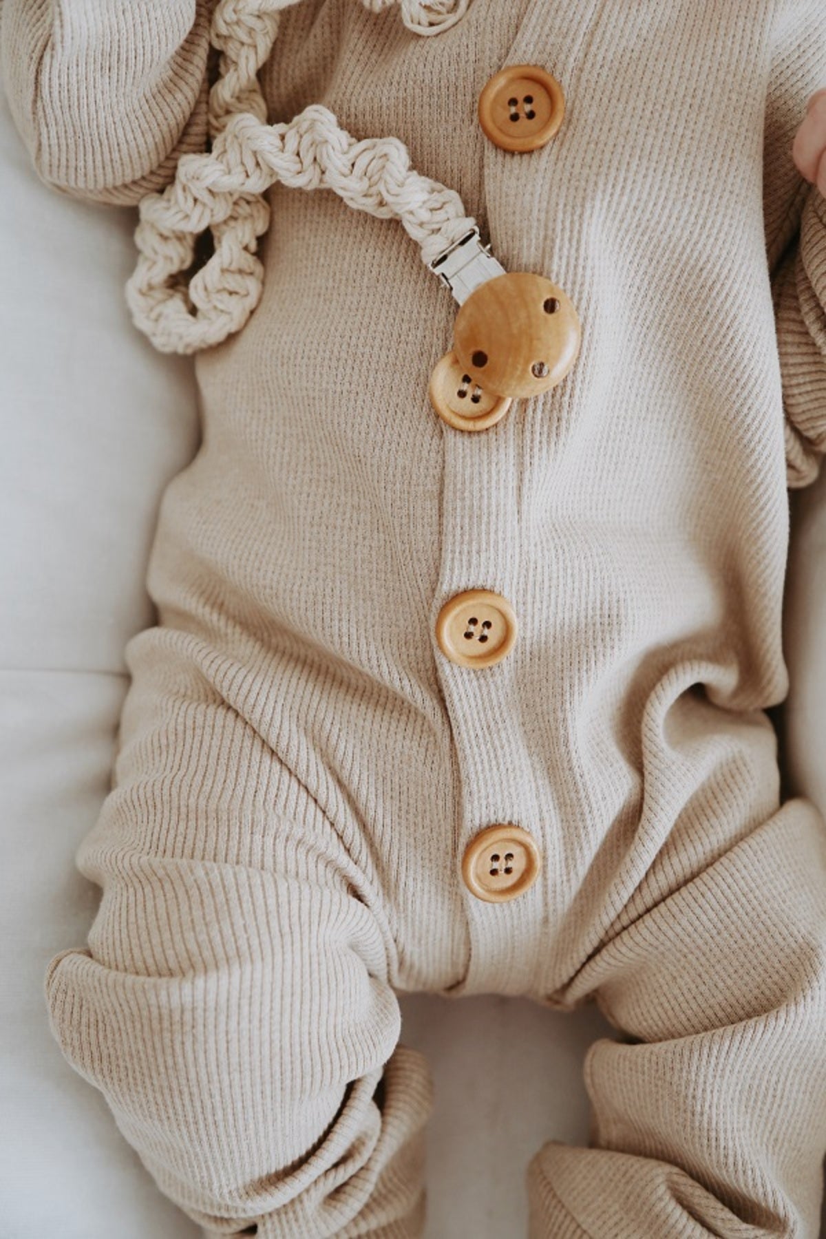 Creamy milky organic cotton sleepsuit. Soft and gentle on delicate skin