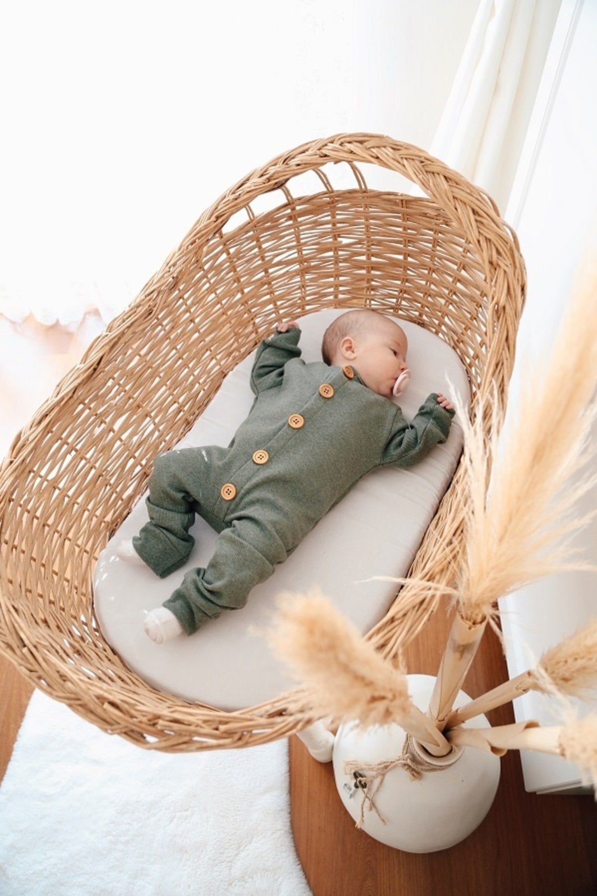 Earthy sage green organic cotton sleepsuit. A soothing and calming color for a peaceful sleep