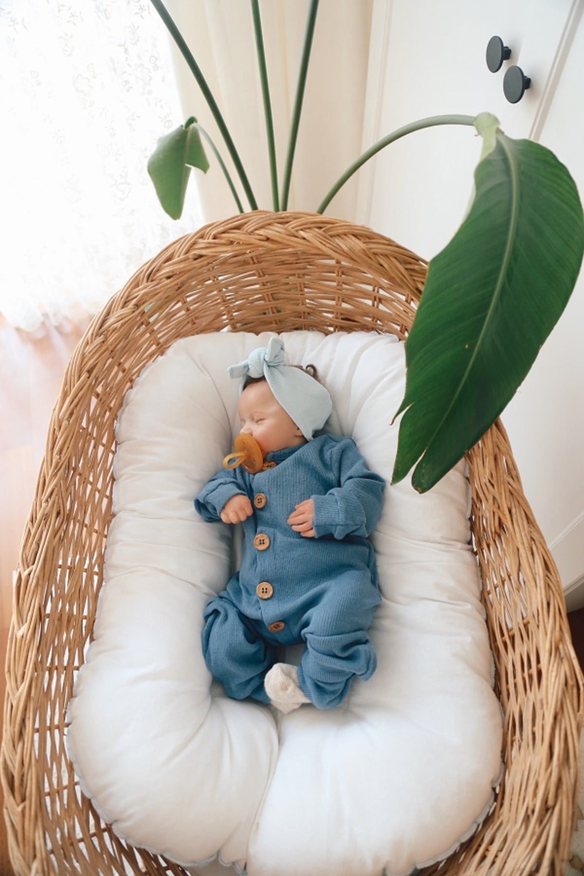 Classic indigo blue organic cotton sleepsuit. A timeless and versatile choice for any baby