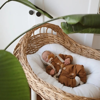 Neutral brown organic cotton sleepsuit. A classic and versatile choice for any baby