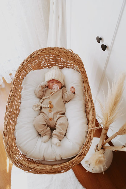 Classic beige organic cotton sleepsuit. A versatile and timeless choice for any baby